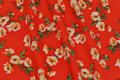 Rayon challis red and orange floral print