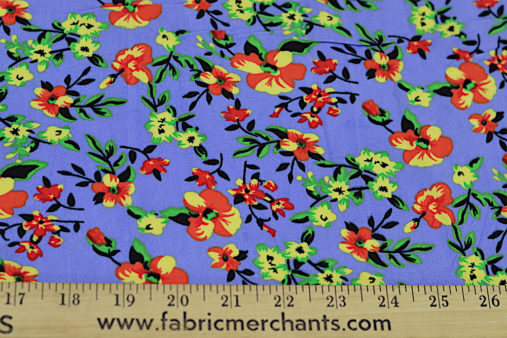 rayon challis with yellow and orange print on a bold purple background